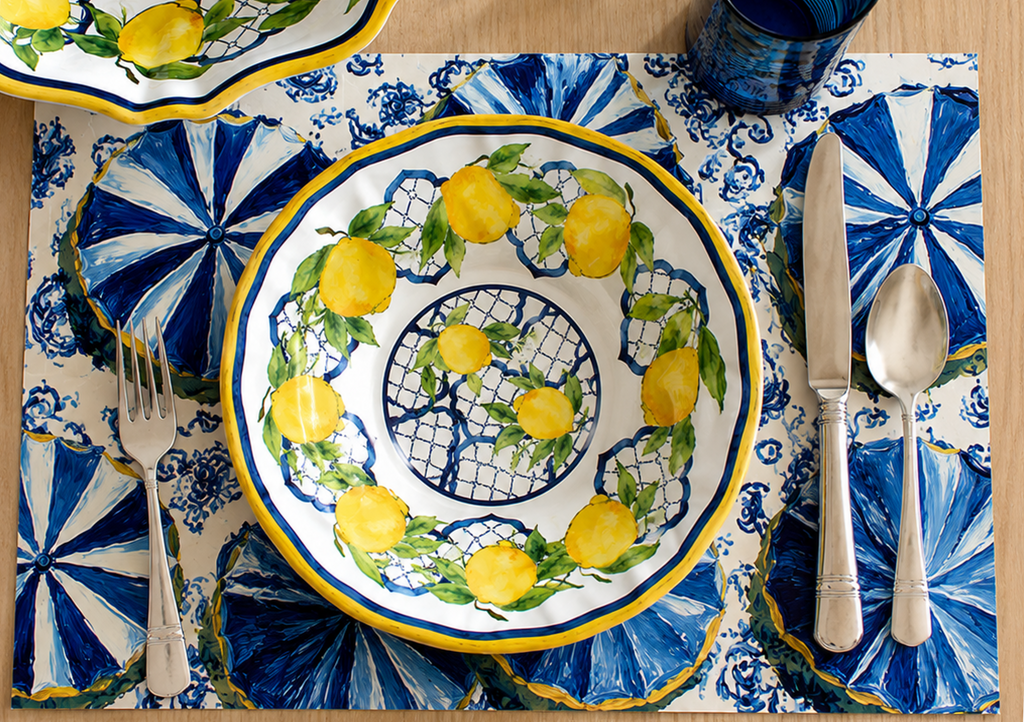 Coastal blue disposable paper placemat with Italian Amalfi village design on a set table
